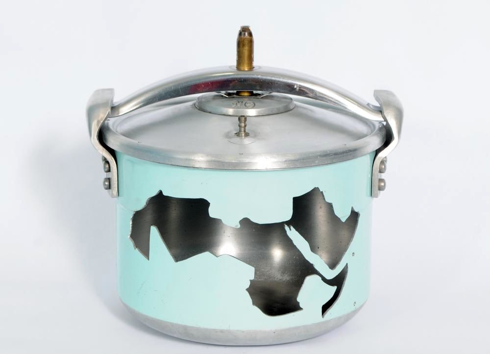 artwork of a pressure cooker with an image of North Africa depicted on the front